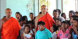 Buddhists monks are in North to support flood victims